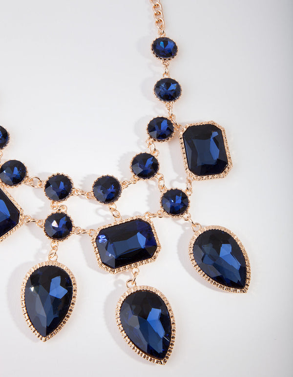 Gouden ketting met blauwe stenen