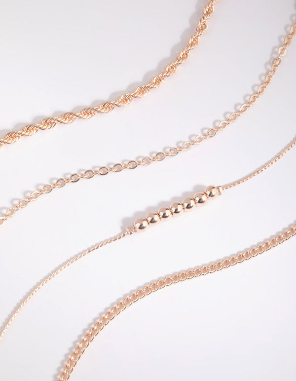 Set van roségouden kralenarmband en enkelbandje