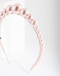 Opaska na głowę z perłami w kolorze rodowanego różu i stopniowaną kulką - link has visual effect only