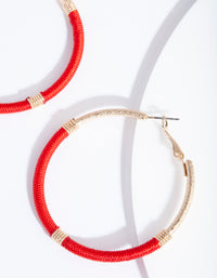 Złota obręcz z czerwonej nici - link has visual effect only