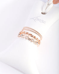 Stapelpakket met roségouden kristallen ringen - link has visual effect only