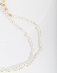 Gouden parel zonnebrilketting - link has visual effect only