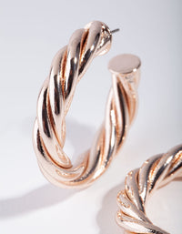 Kolczyki Chub Twist C-Hoop w kolorze różowego złota - link has visual effect only