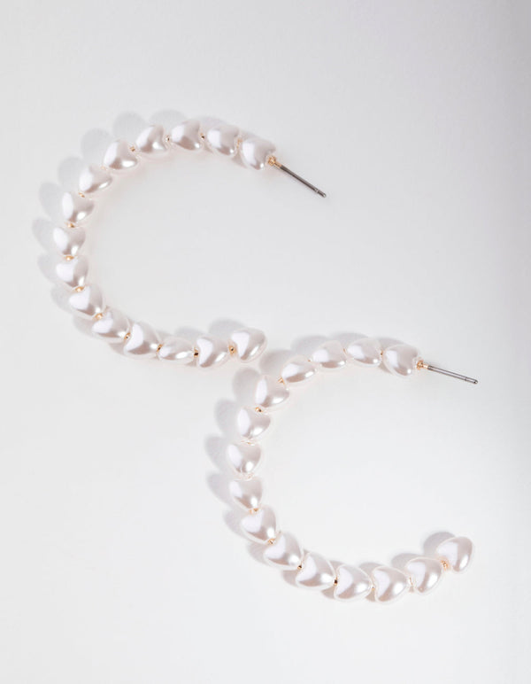 Złote kolczyki z perłami