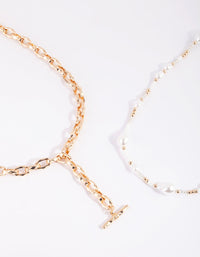 Gouden en witte parelketting - link has visual effect only