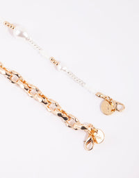 Gouden en witte parelketting - link has visual effect only