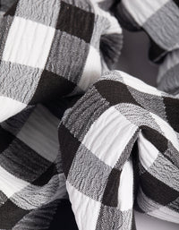Zwart-wit geruite scrunchie - link has visual effect only