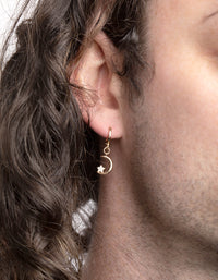 Gouden maanvormige Huggie-oorbellen met kubieke zirkonia - link has visual effect only
